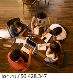 Group of friends studying together for finals. Стоковое фото, агентство Ingram Publishing / Фотобанк Лори