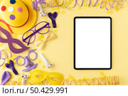 carnival concept copy space tablet disguise elements. Стоковое фото, агентство Ingram Publishing / Фотобанк Лори