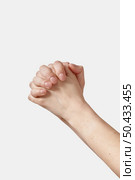 Sade ways female hands help sign, folded into a lock hide, gentle care, praying with two manicured thumbs on top isolated on white background. Woman hands making sign.. Hand lock female hands on white background. Стоковое фото, агентство Ingram Publishing / Фотобанк Лори