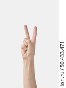 Numeric count on fingers, male hand in vertical position with two, 2, V letter in sign language or finger alphabet isolated on white background. Counting fingers concept.. Counting on fingers female hand, two or V letter on white. Стоковое фото, агентство Ingram Publishing / Фотобанк Лори