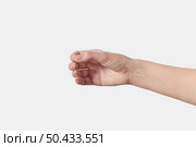 Female hand gesture of holding something like stick isolated on white background.. Female hand holding invisible isolated on white. Стоковое фото, агентство Ingram Publishing / Фотобанк Лори
