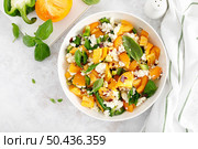 Yellow tomato salad with green paprika, cottage cheese and basil. Healthy food, diet. Top view. Стоковое фото, агентство Ingram Publishing / Фотобанк Лори