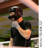 male boxer with gloves helmet. Стоковое фото, агентство Ingram Publishing / Фотобанк Лори