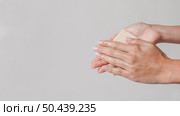 rubbing hands with block soap copy space. Стоковое фото, агентство Ingram Publishing / Фотобанк Лори