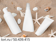 skin products different recipients arrangement sand. Стоковое фото, агентство Ingram Publishing / Фотобанк Лори