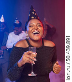 woman showing her champagne glass laughs. Стоковое фото, агентство Ingram Publishing / Фотобанк Лори
