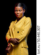 beautiful african woman yellow jacket. Стоковое фото, агентство Ingram Publishing / Фотобанк Лори
