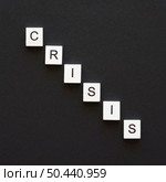 flat lay crisis word written wooden cubes. Стоковое фото, агентство Ingram Publishing / Фотобанк Лори