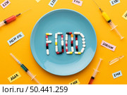 gmo modified food with pills syringes. Стоковое фото, агентство Ingram Publishing / Фотобанк Лори