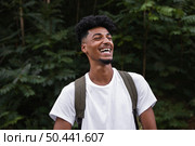 medium shit smiley man wearing backpack. Стоковое фото, агентство Ingram Publishing / Фотобанк Лори