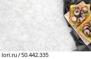 top view avocado toast with radish seeds plate with copy space. Стоковое фото, агентство Ingram Publishing / Фотобанк Лори