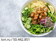 Pork kebab bulgur salad bowl with cucumber, lettuce, thyme and mustard sauce. Стоковое фото, агентство Ingram Publishing / Фотобанк Лори