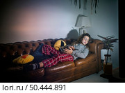 sleepy girl with tv. Стоковое фото, агентство Ingram Publishing / Фотобанк Лори