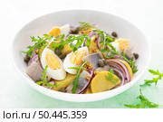 Herring and boiled potato salad with egg, capers and red onion. Стоковое фото, агентство Ingram Publishing / Фотобанк Лори