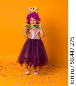 cute girl with clown wig tutu. Стоковое фото, агентство Ingram Publishing / Фотобанк Лори