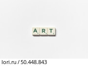 Word art formed of scrabble tiles on white background. Creative template with copy space.. Art formed of scrabble tiles on white background. Стоковое фото, агентство Ingram Publishing / Фотобанк Лори