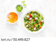 Fresh green vegetarian salad with savoy cabbage, raw carrot, radish, bell pepper, leek and green peas. Стоковое фото, агентство Ingram Publishing / Фотобанк Лори