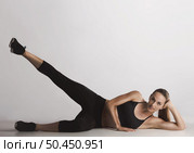 Shot of a beautiful  young woman making a glutes workout . Стоковое фото, агентство Ingram Publishing / Фотобанк Лори
