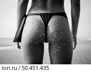Rearview of a hot woman in bikini . Стоковое фото, агентство Ingram Publishing / Фотобанк Лори