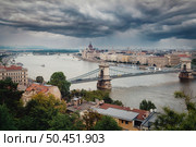 Thunderclouds on the parliament in Budapest, Hungary. Thunderclouds on the parliament. Стоковое фото, агентство Ingram Publishing / Фотобанк Лори