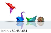 Failure And Loss Transformation  as a backward symbol for regression and regressive concept as a flying bright origami bird regressing and deteriorating to a grey crumpled paper. Стоковое фото, агентство Ingram Publishing / Фотобанк Лори