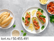 Toasts with salted salmon and avocado guacamole, top view. Стоковое фото, агентство Ingram Publishing / Фотобанк Лори