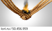 Agreement failure and Business deal fail concept as two hands made of rope in a handshake on fire as a corporate relationship or business crisis and breaking a friendship symbol with 3D illustration elements.. Стоковое фото, агентство Ingram Publishing / Фотобанк Лори