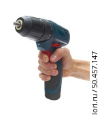 Electric screwdriver in hand isolated on white background. Element of design. Boulding tool and equipment. Стоковое фото, агентство Ingram Publishing / Фотобанк Лори