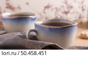 Coockies with egg white cover. Portuguese sweets known as cavacas served with tea on ceramic cups. Стоковое фото, агентство Ingram Publishing / Фотобанк Лори