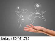The coordinates and the world map are written in white chalk on the hand, draw concept. Стоковое фото, агентство Ingram Publishing / Фотобанк Лори