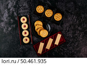 Many cookies are beautifully arranged in a plate and then placed on a wooden table. Top view. Стоковое фото, агентство Ingram Publishing / Фотобанк Лори