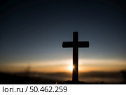 Silhouette of catholic cross and sunrise. Стоковое фото, агентство Ingram Publishing / Фотобанк Лори
