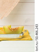 Juicy honeydew melon on a wooden table background. Стоковое фото, агентство Ingram Publishing / Фотобанк Лори