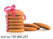 Festive wrapped biscuits pile isolated on a white background. Стоковое фото, агентство Ingram Publishing / Фотобанк Лори