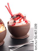 Tasteful strawberry and chocolate pastry mousse on black slate background. Стоковое фото, агентство Ingram Publishing / Фотобанк Лори