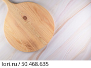 Top view of wooden cutting board on a gray marble background with space for text. Стоковое фото, агентство Ingram Publishing / Фотобанк Лори