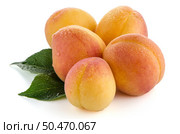 Sweet peaches with leafs on a white background. Стоковое фото, агентство Ingram Publishing / Фотобанк Лори