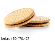 Sandwich biscuits with chocolate filling on a white background. Стоковое фото, агентство Ingram Publishing / Фотобанк Лори
