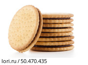 Sandwich biscuits with chocolate filling on a white background. Стоковое фото, агентство Ingram Publishing / Фотобанк Лори