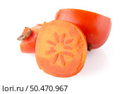 Ripe persimmons on white background. Стоковое фото, агентство Ingram Publishing / Фотобанк Лори