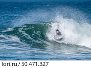 Bodyboarder surfing ocean wave on a sunny winter day. Стоковое фото, агентство Ingram Publishing / Фотобанк Лори