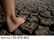 Children are walking barefoot on mud,selective focus. Стоковое фото, агентство Ingram Publishing / Фотобанк Лори