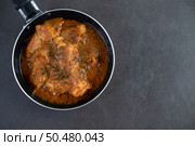 Massaman curry in a frying pan on the cement floo. Top view. Стоковое фото, агентство Ingram Publishing / Фотобанк Лори