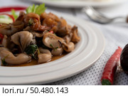 Stir fried basil with squid and shrimp, seafood style Thai food. Стоковое фото, агентство Ingram Publishing / Фотобанк Лори