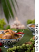 Chicken curry with Wax gourd in a ceramic cup, Selective focus. Стоковое фото, агентство Ingram Publishing / Фотобанк Лори