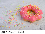 strawberry donut decorated icing and sprinkling on the floor. Стоковое фото, агентство Ingram Publishing / Фотобанк Лори