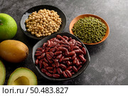 legumes and fruit on a black cement floor background. Стоковое фото, агентство Ingram Publishing / Фотобанк Лори