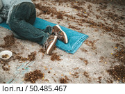 The beggars lay on their side of the street with dirty clothes. Стоковое фото, агентство Ingram Publishing / Фотобанк Лори