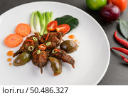 Spicy Fried Stir Catfish on white plate, Thai food. Selective focus. Стоковое фото, агентство Ingram Publishing / Фотобанк Лори