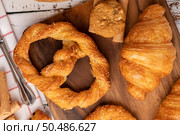 Various breads on red white cloth. Top view. Стоковое фото, агентство Ingram Publishing / Фотобанк Лори